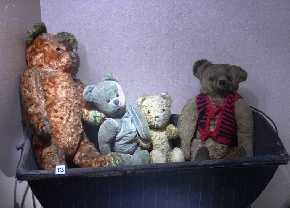 Four teddy bears in different colors. The teddy bears come from The Museum of Toys and Play in Kielce. Photo by Dorota Zoladz-Strzelczyk.